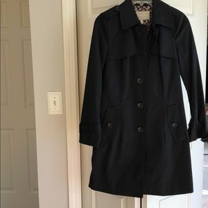 Staple!  Black trench with a pop on the inside